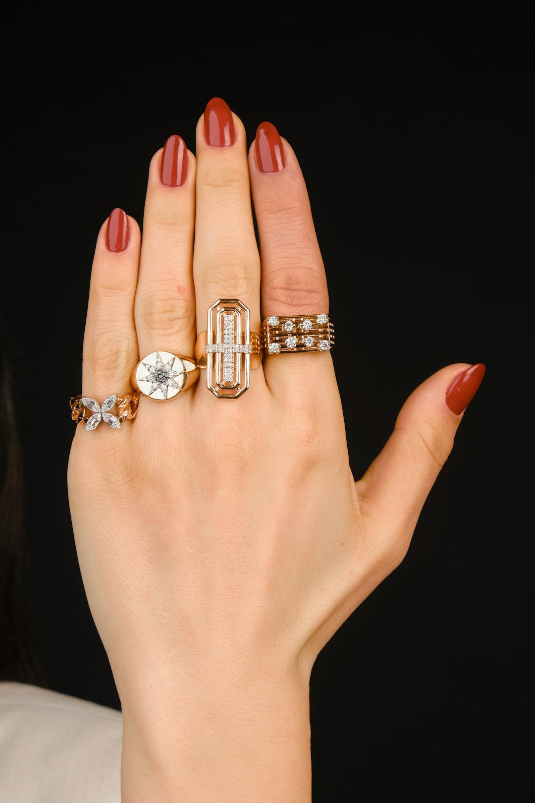 a-womans-hand-with-three-rings-on-it-xhdcutdccfu